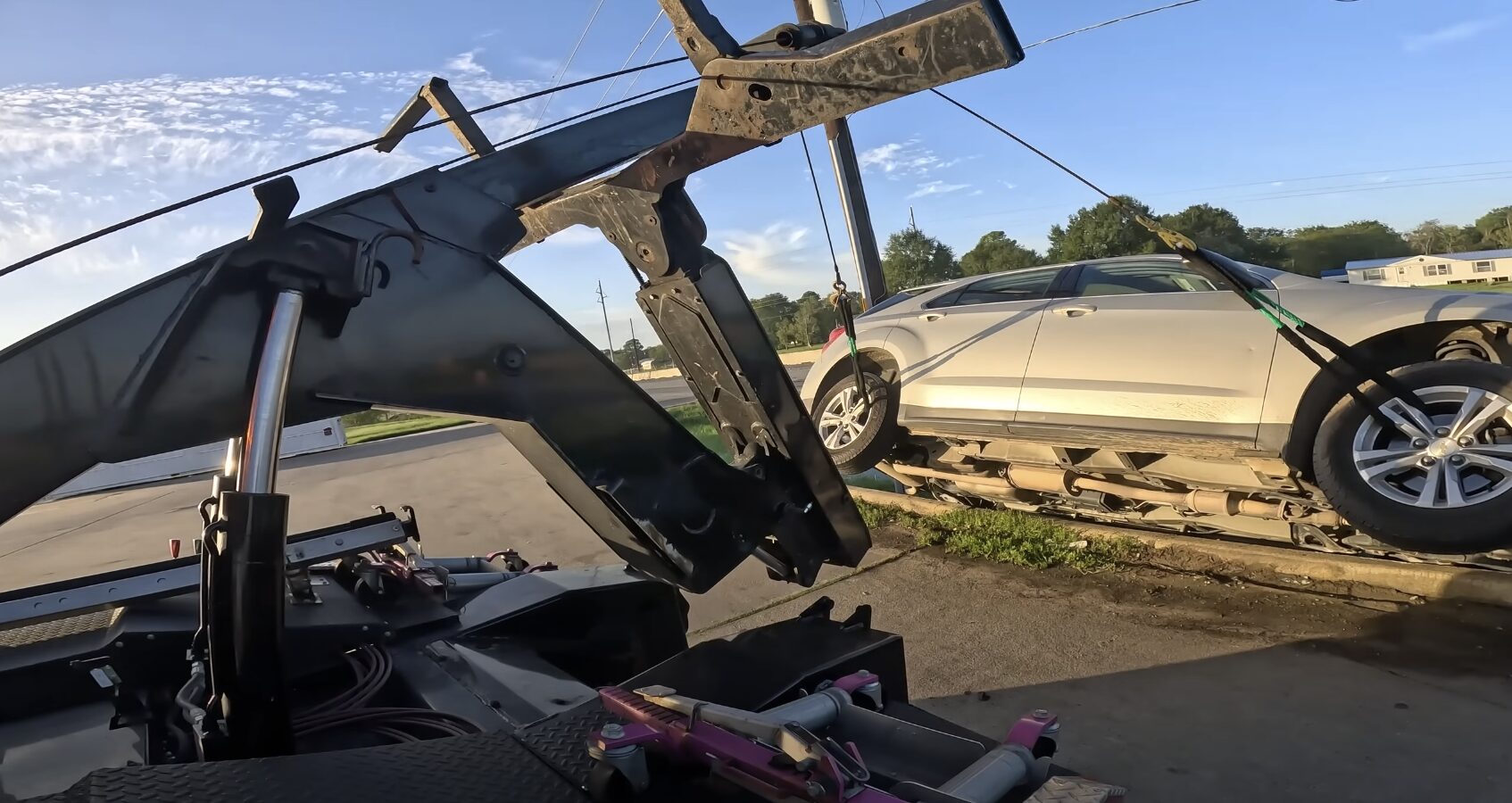Professional tow truck with flatbed equipment ready for emergency towing service